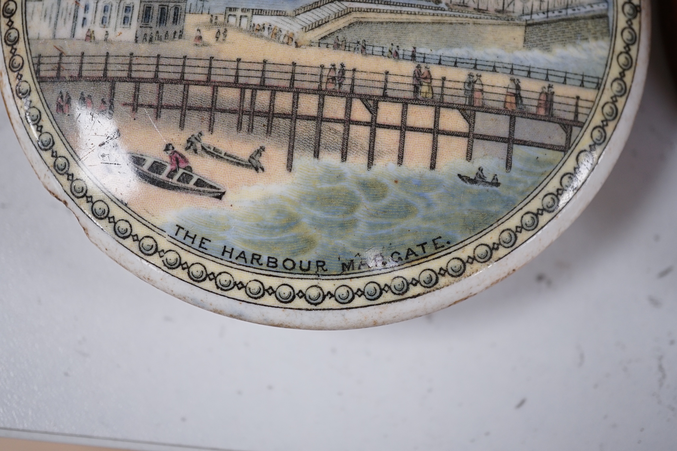 Eleven 19th century mostly framed pot lids including ‘The Ning Po River’, ‘Rifle Contest Wimbledon 1868’, ‘Vue De La Ville De Strasbourg Prise De Port’ etc. Condition - fair to good